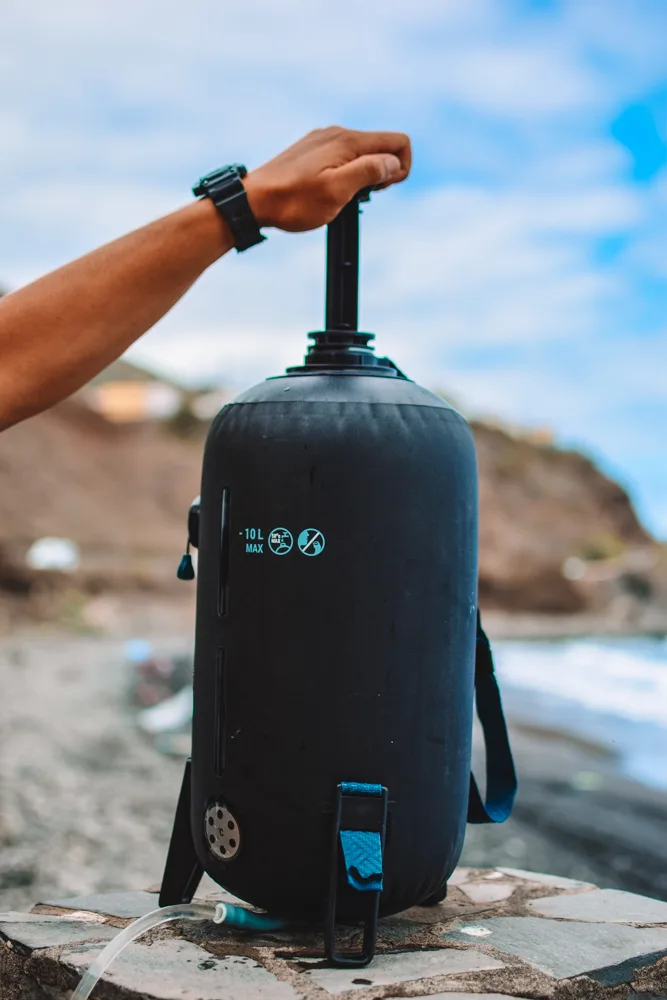 How to use a portable shower with pressure system