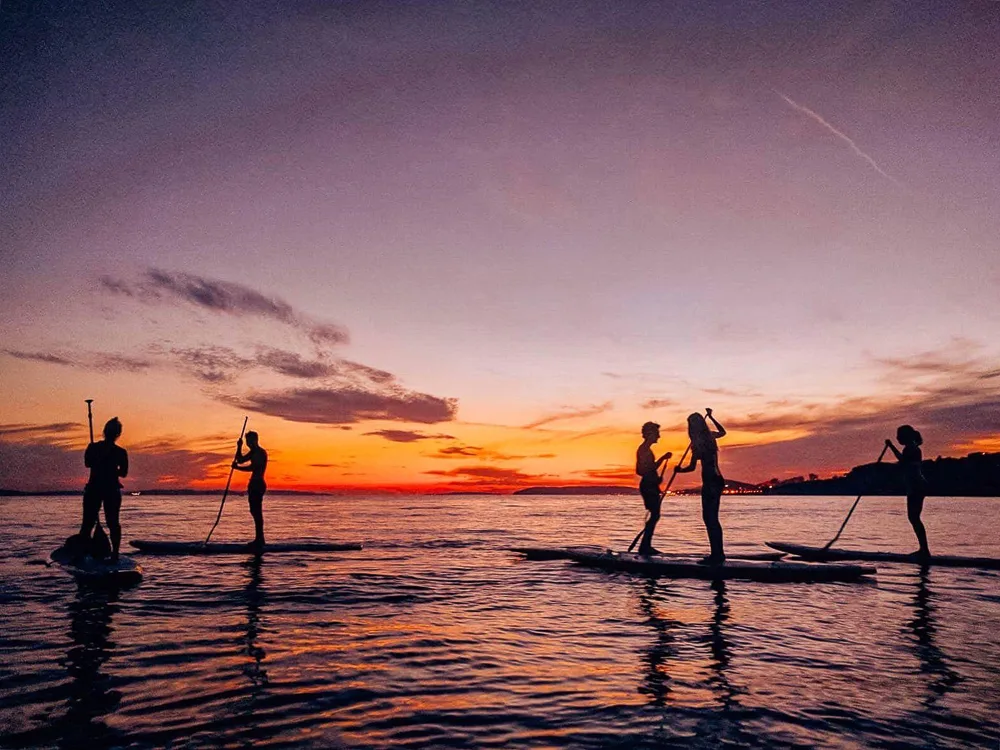 Going for a sunset SUP session with friends