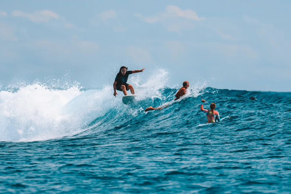 Alejandro and Greta surfing in Mentawai, Indonesia